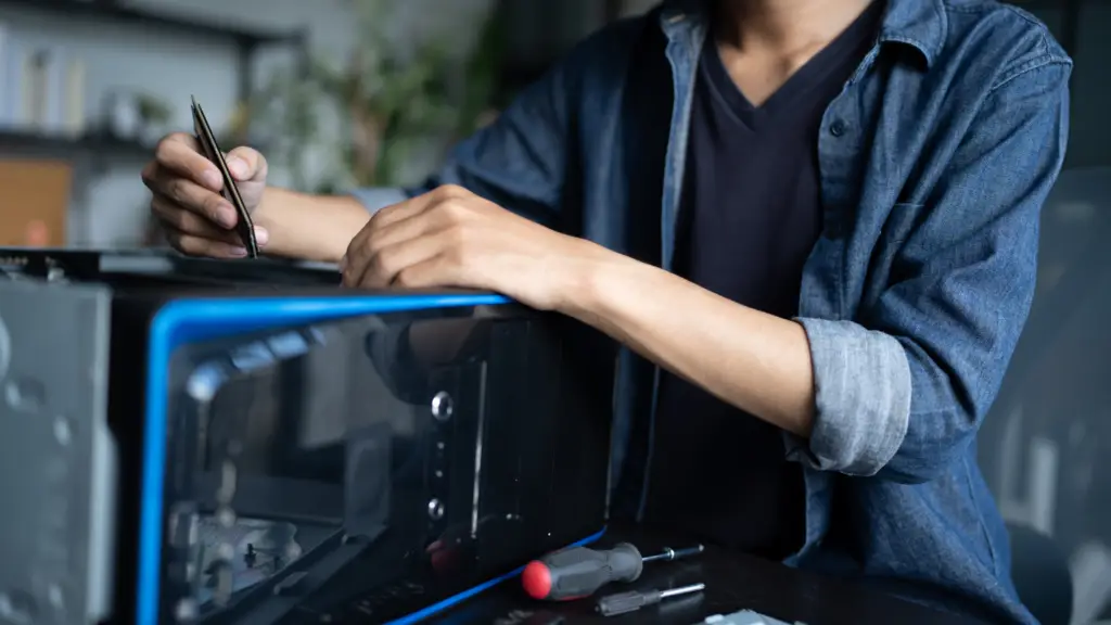 a man fixing IT equipment